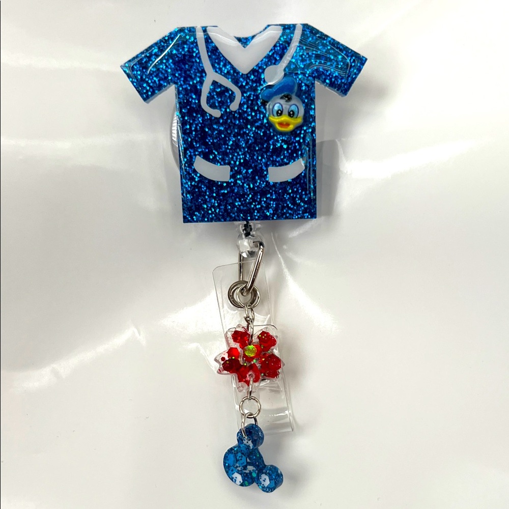 New Donald Duck Blue Glitter Scrub Top Badge Reel with Charms